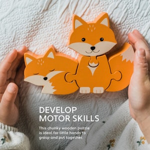 May include: A chunky wooden puzzle featuring a fox with orange and white paint. The puzzle is made up of four pieces and is ideal for developing motor skills.