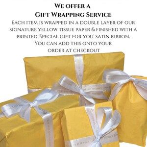 May include: Four yellow gift boxes with white satin ribbon tied in bows. The ribbon has the text "Special Gift For You" printed on it. The boxes are stacked on top of each other. The Honey Pot Workshop logo is visible on the boxes.