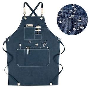 May include: A dark blue denim apron with multiple pockets and adjustable straps. The apron has a water-resistant finish and is perfect for a variety of tasks.