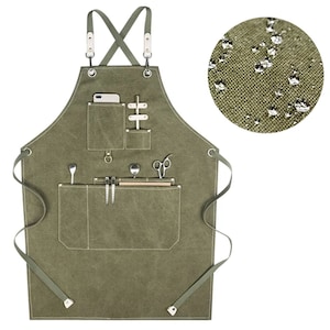 May include: A green canvas apron with multiple pockets and a cross-back strap design. The apron is water-resistant and has a variety of pockets for tools and supplies.