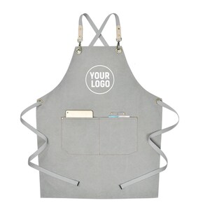 May include: Gray apron with a pocket and leather straps. The apron has a white circle with the text "YOUR LOGO" printed on it. The apron has a pocket with a phone and a notepad inside.