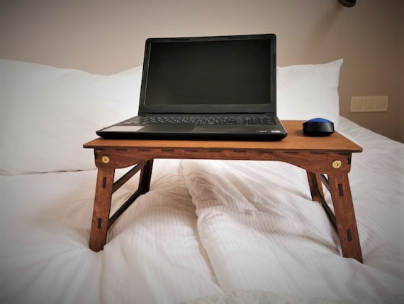 Compact table for laptop outlet