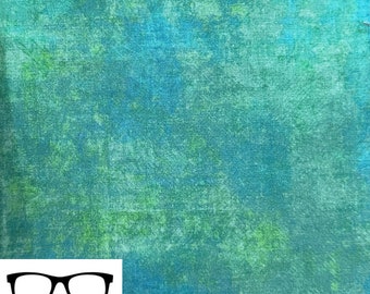 May include: A teal and green fabric with a mottled, textured appearance. The fabric has a subtle, faded look, with shades of blue and green blending together.