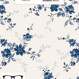 May include: A white fabric with a blue floral pattern. The fabric features a repeating pattern of blue flowers and leaves on a white background. The fabric is labeled "Liberty & Bridgerton Fabrics" and "shondaland | NETFLIX".