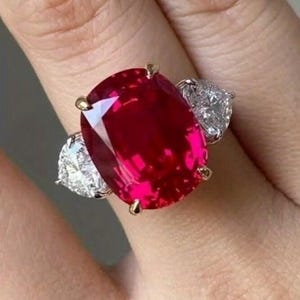 May include: A handmade wooden sign with the text "Welcome" in a handwritten style. The sign is painted white with a distressed finish and features a small, decorative heart. Perfect for front door decor.