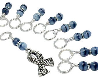 May include: Set of 10 blue and silver stitch markers with a silver ribbon charm. The stitch markers are made of glass beads with silver wire and silver rings. The ribbon charm is a silver ribbon with a braided design.