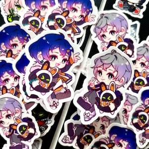 May include: A collection of colorful stickers featuring cartoon characters with bunny-like companions. The characters have different hair colors and styles, and they are all wearing casual clothing. The stickers are printed on white paper and have a glossy finish.