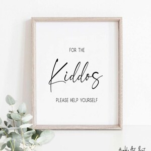 May include: A white framed print with black text that reads "For the Kiddos Please Help Yourself".