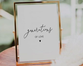 Op de afbeelding: Een gouden lijst met een witte achtergrond en zwarte tekst die "generations of love" luidt met een klein zwart hartje onder de tekst.
