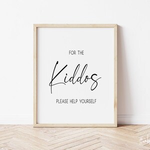 May include: A white framed print with black text that reads "For the Kiddos Please Help Yourself".
