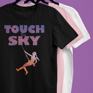 TOUCH THE SKY Rock Climbing Adult Unisex T-Shirt| Mountaineer| Bouldering| Rappelling| Women&#39;s sports| Female Athlete| Sunset| Clouds