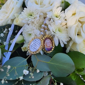 May include: Two gold-toned memorial charms with white ribbon. One charm has a photo of a woman and the other has the text "On this special day, know that I am here with you. Walking with you down the aisle. My daughter, my heart."