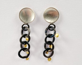 boucles d'oreilles en argent noirci avec de l'or