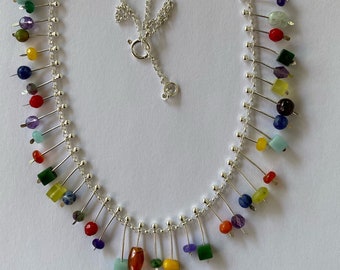 Silver necklace with small gemstone pendants