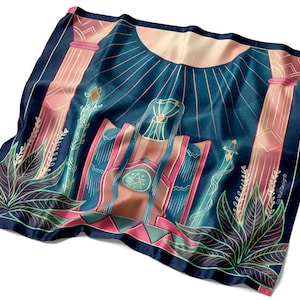May include: A blue and pink patterned silk scarf with a geometric design featuring a central image of a throne with a star and a sun above. The scarf has a green and pink border with a floral design.