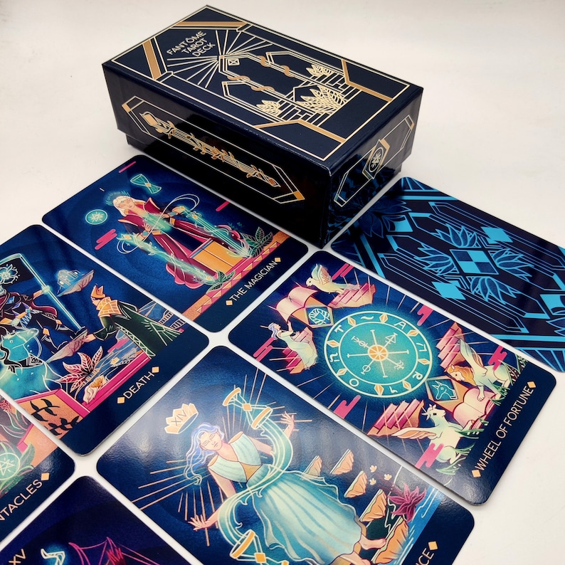 May include: A tarot deck with a blue and gold box. The cards feature colorful illustrations of various tarot symbols, including the Magician, Death, and Wheel of Fortune.