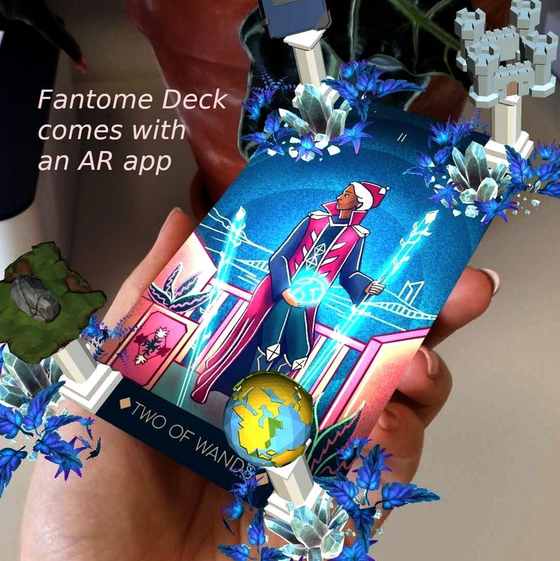 May include: A tarot card with a blue background and a person in a red and gold robe holding a blue orb. The card is titled "Two of Wands" and has a blue and white design. The card is surrounded by blue and white crystals and a white structure.