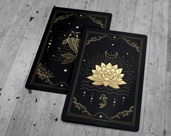May include: Two black cards with gold foil designs. The first card features a gold fish swimming in water with a crescent moon and stars. The second card features a gold lotus flower with a crescent moon and stars.