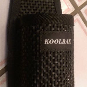 May include: Black mesh bottle holder with the word "KOOLBAK" printed on the front.