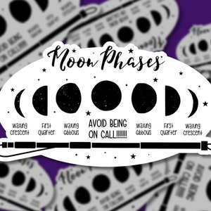 May include: White sticker featuring a black and white illustration of moon phases. The sticker includes the text "Moon Phases" and "AVOID BEING ON CALL!!!!!!". The phases are labeled "waxing crescent", "first quarter", and "waxing gibbous".