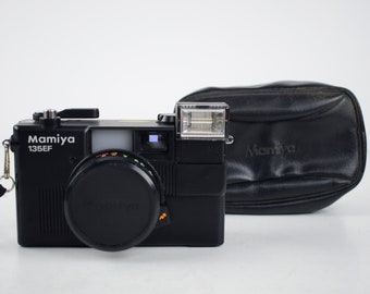 cámara de película vintage Mamiya 135EF con estuche / ¡No funciona!