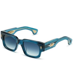 May include: Blue square-framed sunglasses with gradient lenses. The frames are a translucent teal color with gold accents on the temples and hinges. The lenses transition from a darker blue at the top to a lighter blue at the bottom.