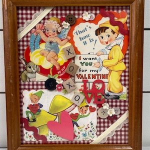 May include: A framed collage with a red and white gingham background. The collage features various Valentine's Day themed images, including a fairy, a bunny, a heart, and a mushroom. The collage also includes the words "I want you for my Valentine" and "Love".