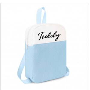 May include: A light blue backpack with a white top panel and the word "Teolcy" written in black cursive.