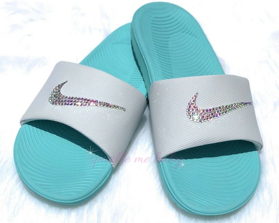 blue and green nike slides