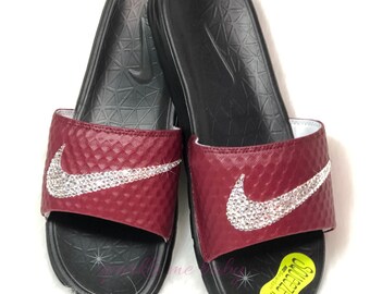 burgundy nike sandals with gold check