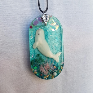Unusual cute epoxy resin pendant with white beluga whale. Great gift for a child and an adult.