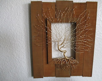 Gold wire tree mounted on barnwood