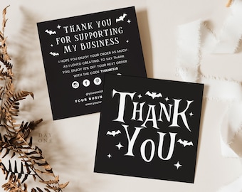 May include: Two black square cards with white text. One card reads "THANK YOU" with bat and star graphics. The other card says "THANK YOU FOR SUPPORTING MY BUSINESS" with social media icons and a discount code. A fern and white ribbon are in the background.