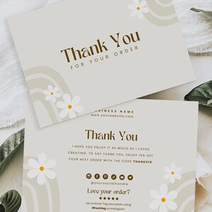 May include: A thank you card with a brown and white floral design. The card has the text "Thank You" and "For Your Order" in brown text. The card also has the text "Business Name" and "www.yourwebsite.com" in smaller brown text. The card has a white background with a brown and white floral design.