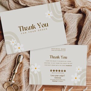 May include: A thank you card with a floral design and the text "Thank You for Your Order". The card is on a wooden surface with a brown fabric.