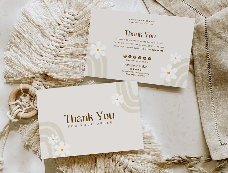 May include: A thank you card with a brown and white abstract design featuring a rainbow and white daisies. The card says "Thank You" and "Thank You for your order".
