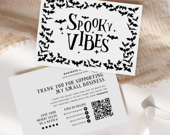 May include: A white thank you card with black bats around the border. The text "Spooky Vibes" is in the center of the card. The card also includes a QR code and social media handles for the business.