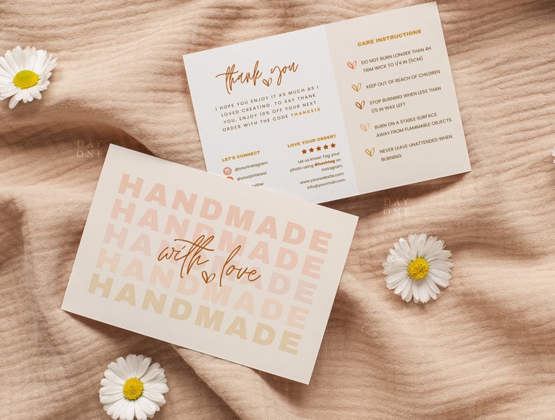 May include: A card with the text "Handmade with love" repeated in a gradient of pink and orange colors. The card also includes care instructions for a candle, such as trimming the wick to 1/4 inch and keeping it out of reach of children.