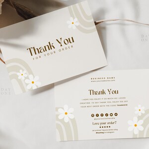 May include: Thank you card with a brown and beige abstract design featuring white daisies. The card says "Thank You for your order" and includes the text "Day One".