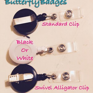 May include: Three retractable badge holders are shown. The top and bottom holders are black, and the middle one is white. The top holder has a standard clip, the middle one says "Black Or White", and the bottom one has a swivel alligator clip. The text "ButterflyBadges" is at the top.