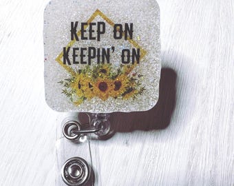 Keep on sunflower badge reel