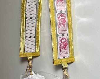 Arcade Tickets gold trimmed shoulder purse strap