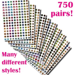 May include: A set of 750 pairs of colourful doll eyes, with many different styles. The eyes are arranged in rows on sheets of paper.