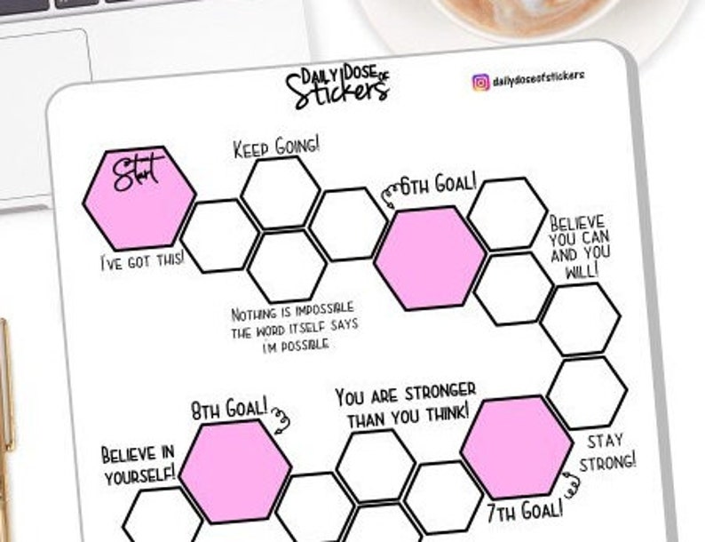 May include: A printable planner sticker sheet with a motivational honeycomb design. The sheet features pink hexagonal stickers with inspirational phrases like "Start", "Keep Going!" and "Believe in Yourself!"
