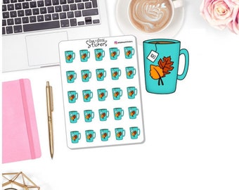 May include: A sheet of 36 teal blue stickers featuring a cartoon mug with a tea bag and two autumn leaves. The mug has the word "tea" written on the tea bag. The text "Daily Dose of Stickers" is at the top of the sheet.
