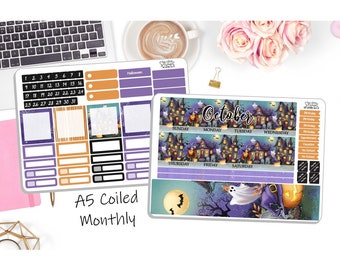May include: A5 monthly planner with a Halloween theme. The planner has a purple and orange color scheme with a spooky house illustration. The planner includes a calendar grid, a to-do list, and a notes section. The planner also includes a variety of stickers with Halloween themes.