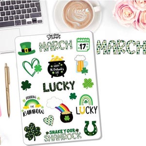 May include: A sticker sheet with St. Patrick's Day themed designs. Includes a green leprechaun hat, shamrocks, rainbows, pots of gold, and the words "March", "Lucky", and "Shake Your Shamrock".