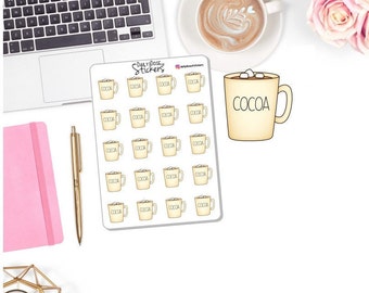 May include: A sheet of 20 cocoa-themed stickers featuring a mug of hot cocoa with marshmallows. The stickers are white with a yellow outline and black text that reads "COCOA".