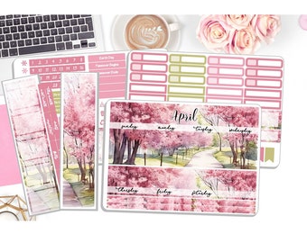 May include: Pink and white planner stickers with a watercolor design of a path through a park with cherry blossom trees. The stickers include a calendar grid, daily boxes, and days of the week labels. The text "April" is featured on the sticker.
