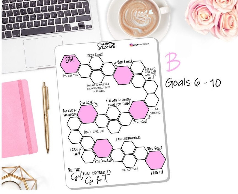 May include: A white dry-erase board with a pink honeycomb design. The board has motivational phrases and goals written on it. The board is labeled "Daily Dose Stickers" and "Goals 6-10".